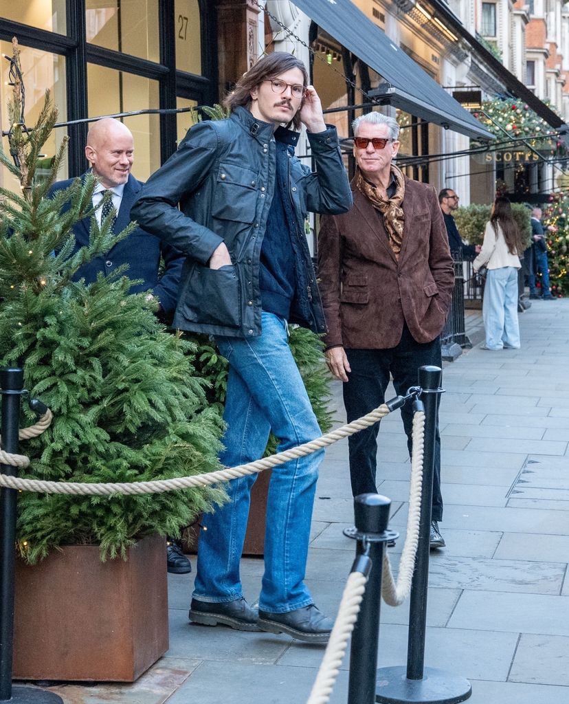 Pierce Brosnan in brown blazer with his son Dylan in jeans and leather jacket in London