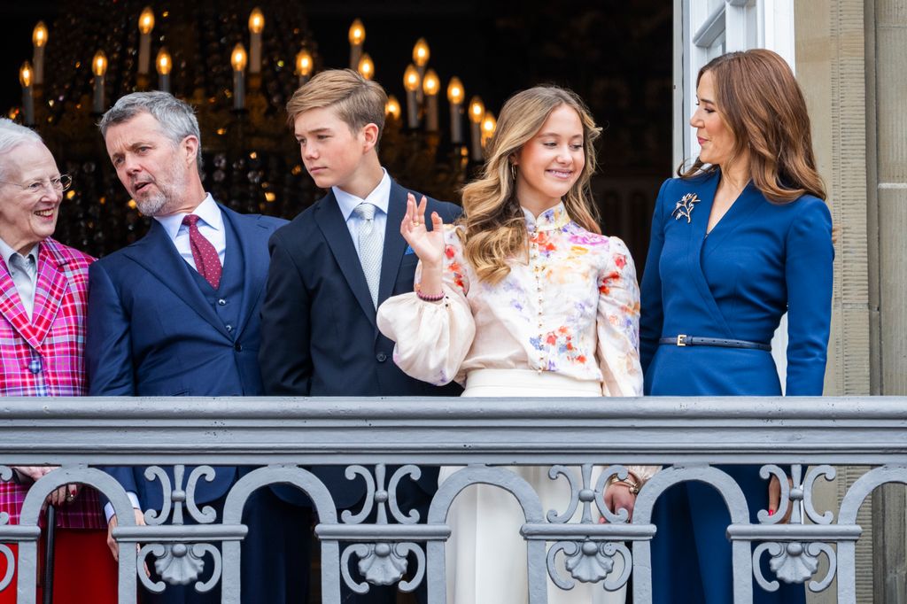 Princess Josephine waving from balcony as Mary smiles