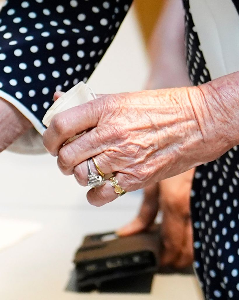 Clos-up of Queen Camilla's gold pinky ring