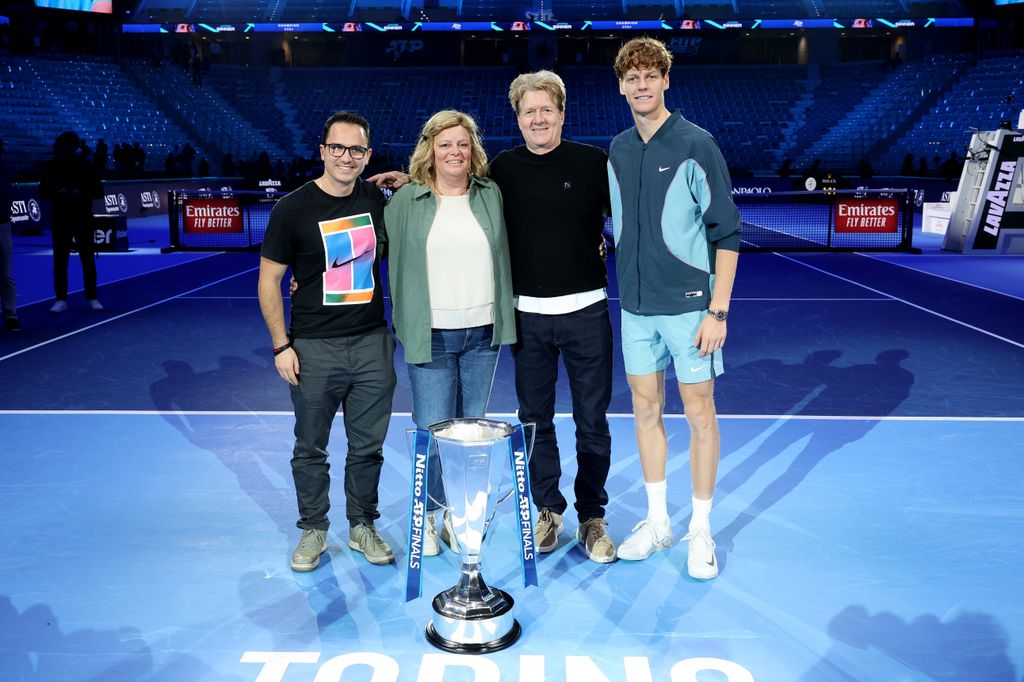 Jannik Sinner of Italy (R) poses for a photo with his parents Siglinde Sinner and Hanspeter Sinner alongside brother Marc Sinner (L) after his victory against Taylor Fritz of United States after the Men's Singles final match on day eight of the Nitto ATP finals 2024 at Inalpi Arena on November 17, 2024 in Turin, Italy