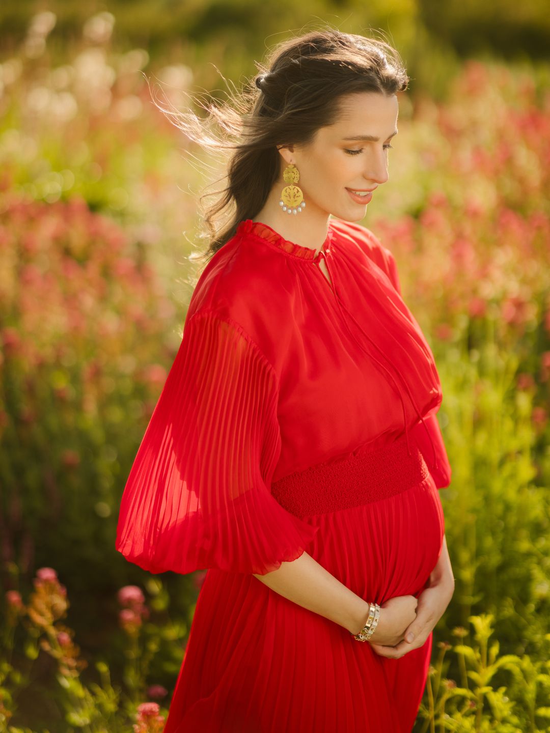 Princess Rajwa in a red dress