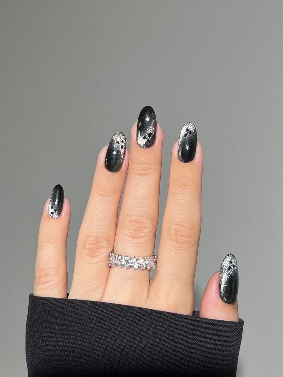 Black nails with glitter ghosts 