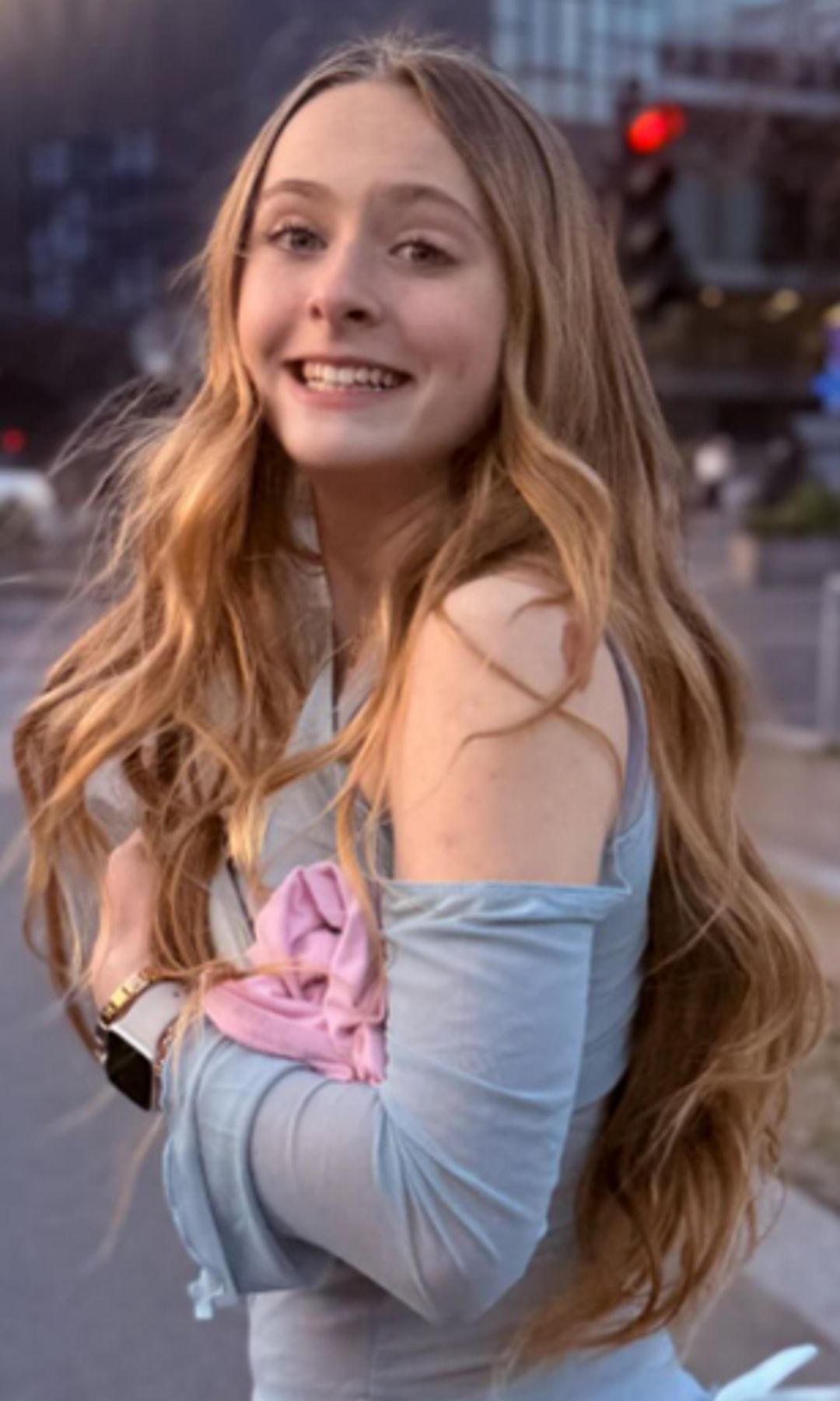 Olive Tennant standing on a street