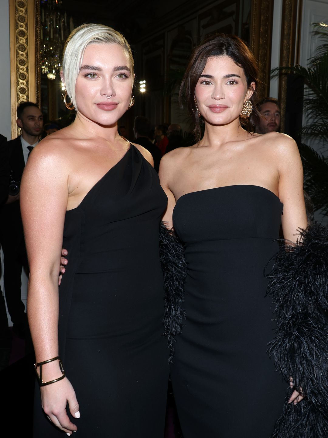 Florence Pugh and Kylie Jenner attend the Valentino Haute Couture Spring/Summer show in paris wearing matching black gowns 
