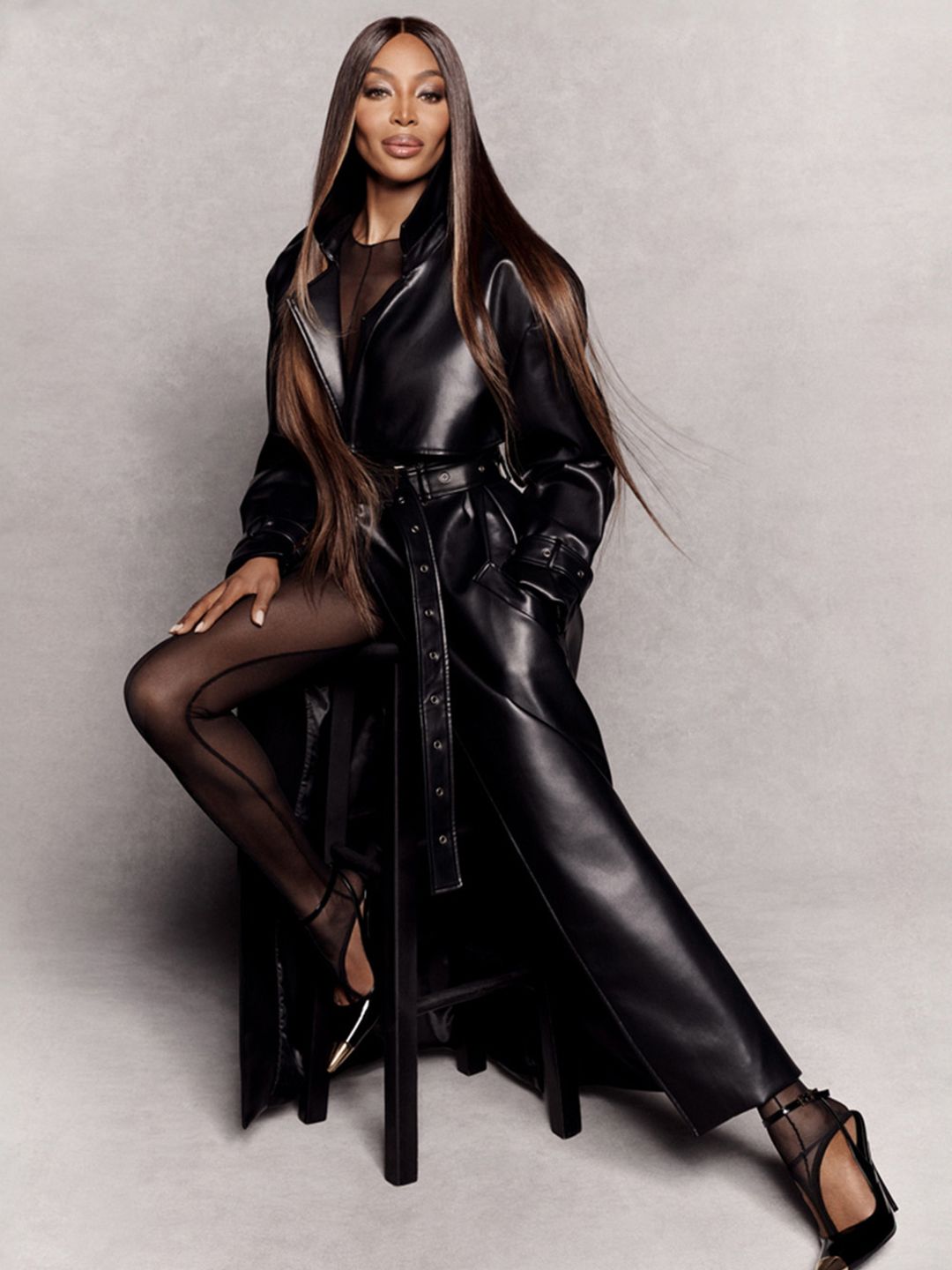 Naomi Campbell in a leather maxi coat for her Pretty Little Thing collection 
