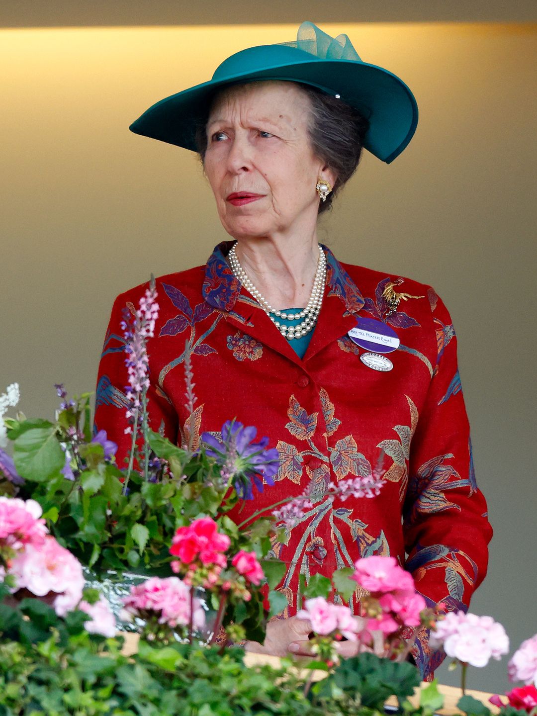 Princess Anne looked concerned in a red floral dress