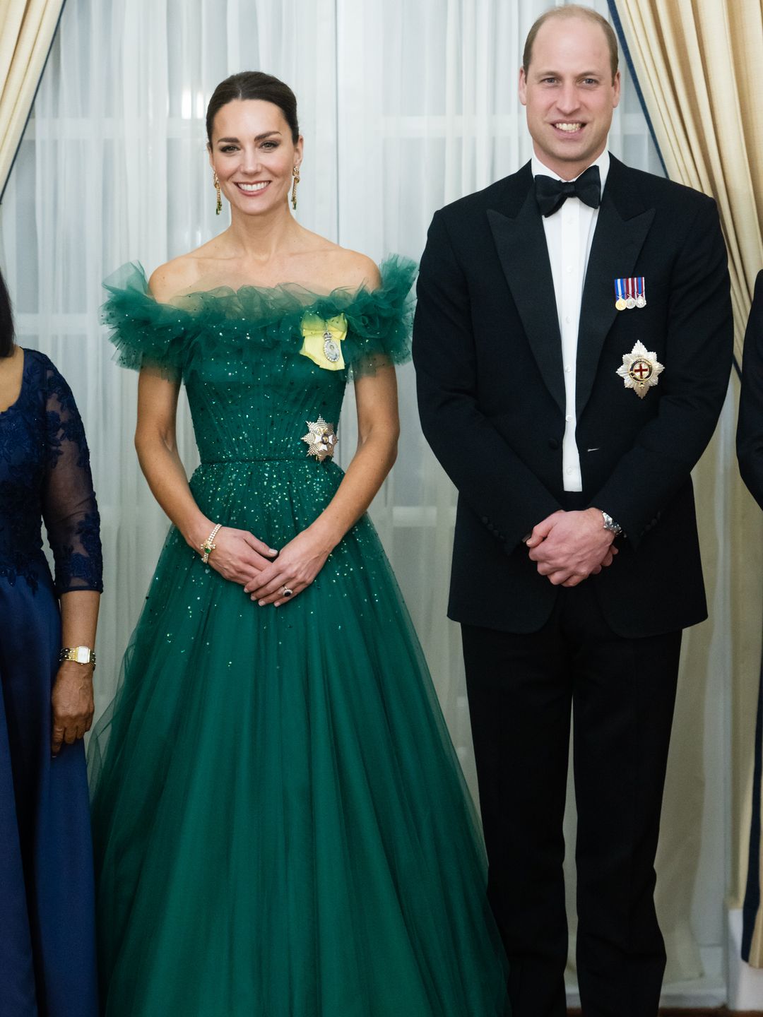 Catherine, Duchess of Cambridge attends a dinner hosted by the Governor General of Jamaica at King's House wearing Jenny Packham