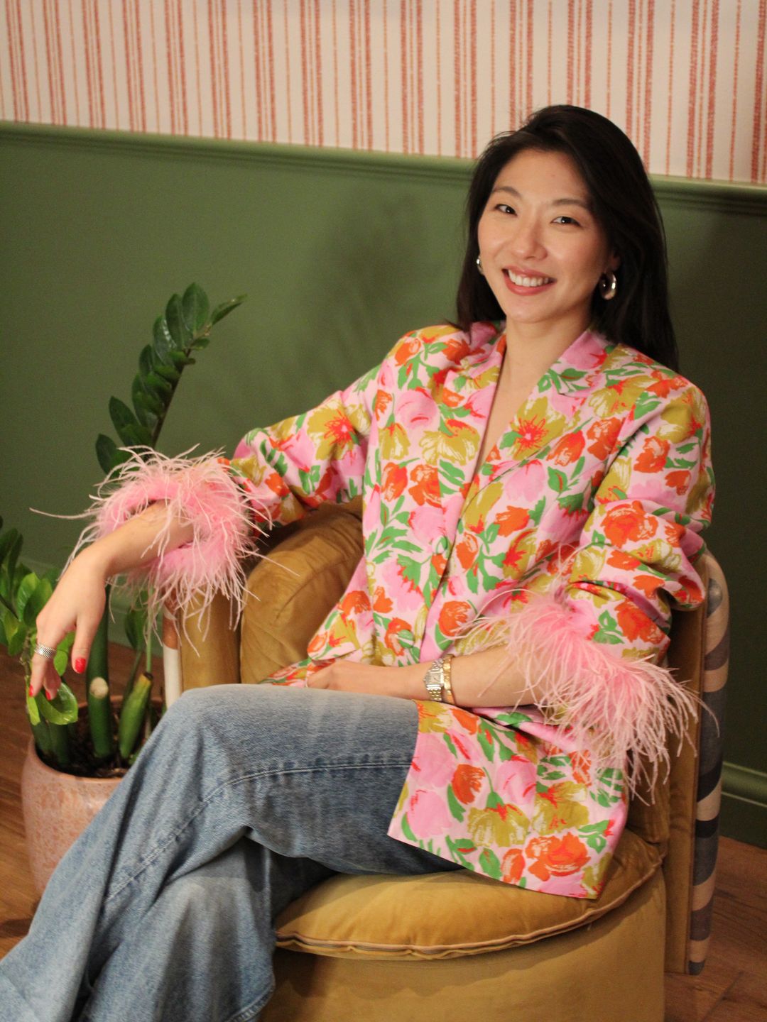 Haeni Kim's new profile picture. She wears a colourful blazer with pink feather trim