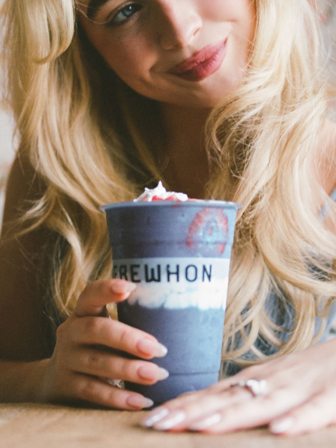 Sabrina Carpenter poses with her Erewhon smoothie