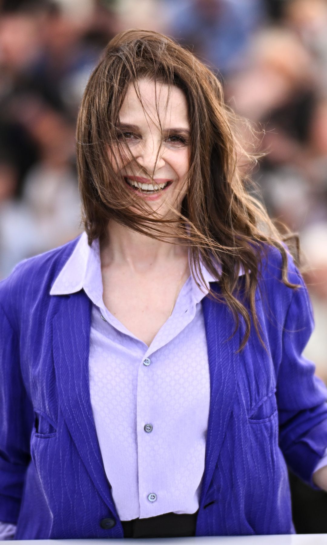 Juliette Binoche with her hair blown over her face