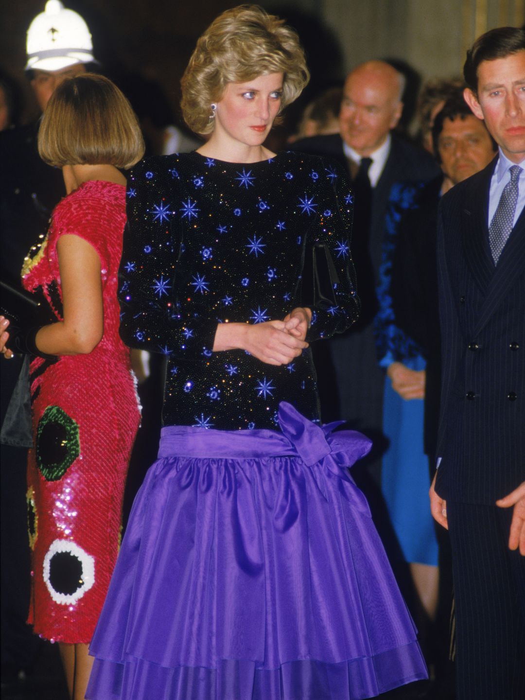 The Prince and Princess of Wales attend a dinner held by the Mayor of Florence during a tour of Italy, April 1985. The Princess wears a dress by Jacques Azagury. 