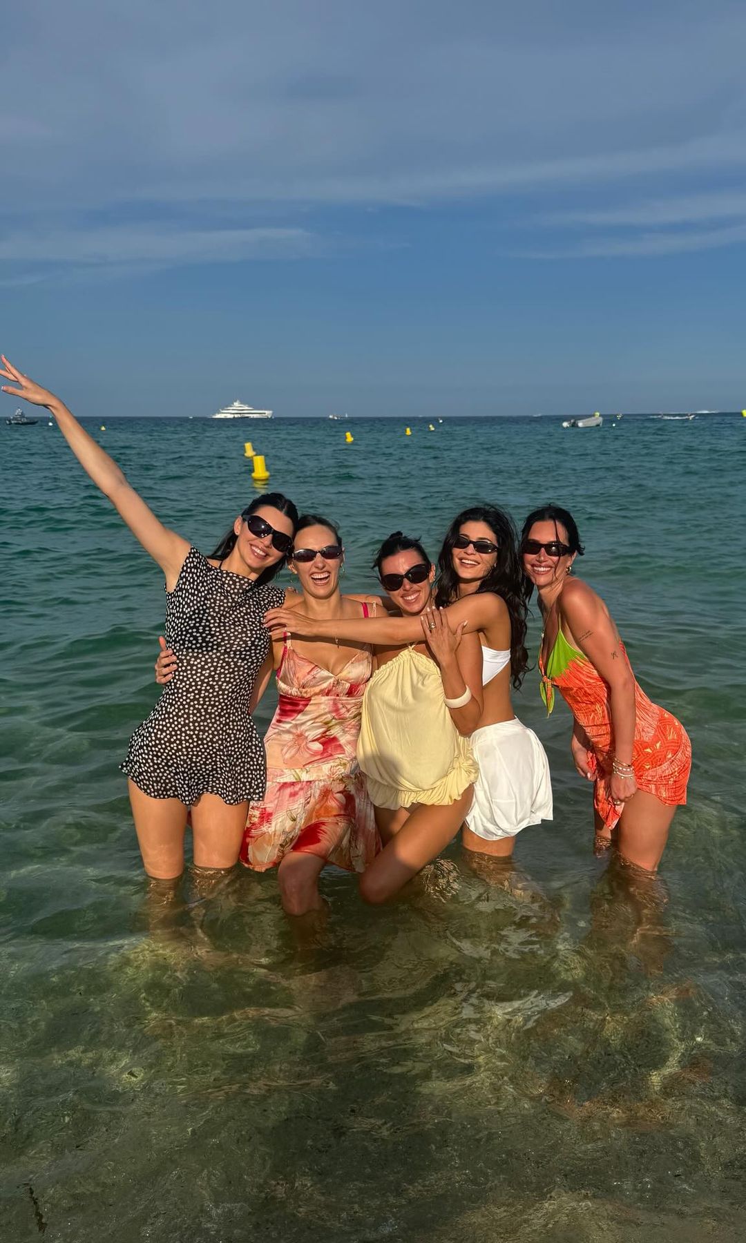 Kylie Jenner and friends pose for a group pic in the ocean
