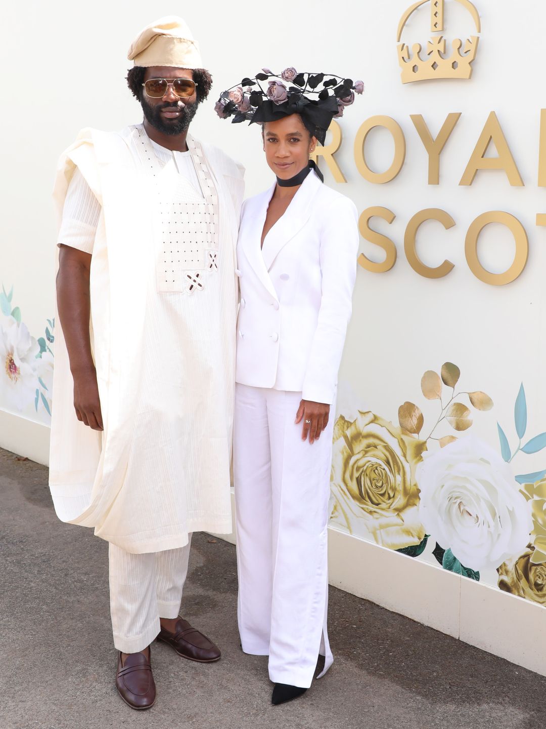Actor Sope Dirisu and Dominique Tipper attend the Longines Royal Ascot private suite with Sope wearing formal Nigerian attire the latter opting for a Rachel Trevor Morgan headpiece and
Ted Baker suit 
