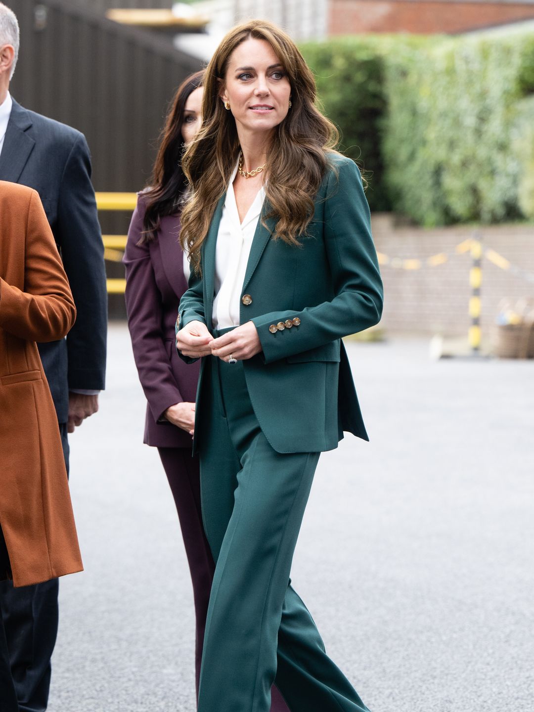 Princess Kate wearing a forest green wool suit by British heritage label Burberry 