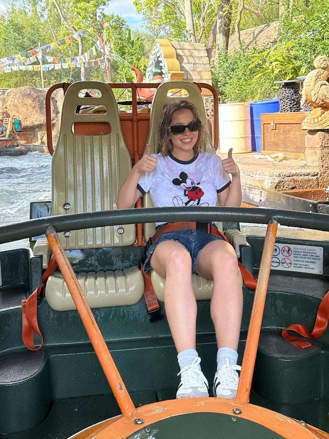 Sydney Sweeney poses on a water ride at Disneyland