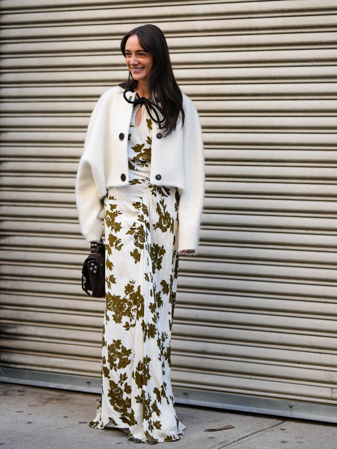 NYFW guest wearing white jacket with flowy printed maxi 