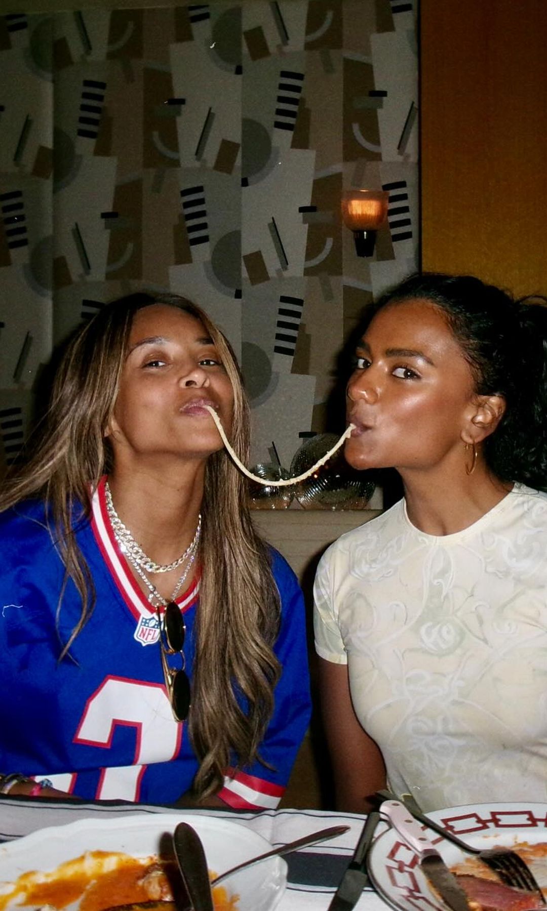 Simone Ashley and Ciara pose for a snap at dinner