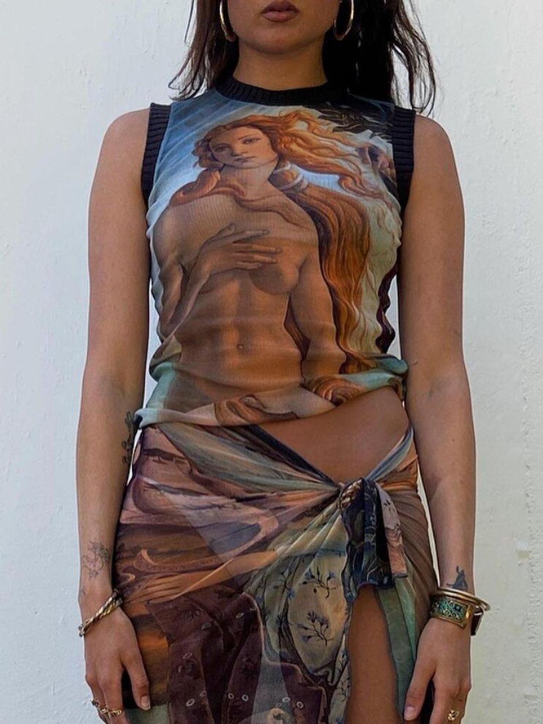 Woman wears Botticelli painting printed knit 