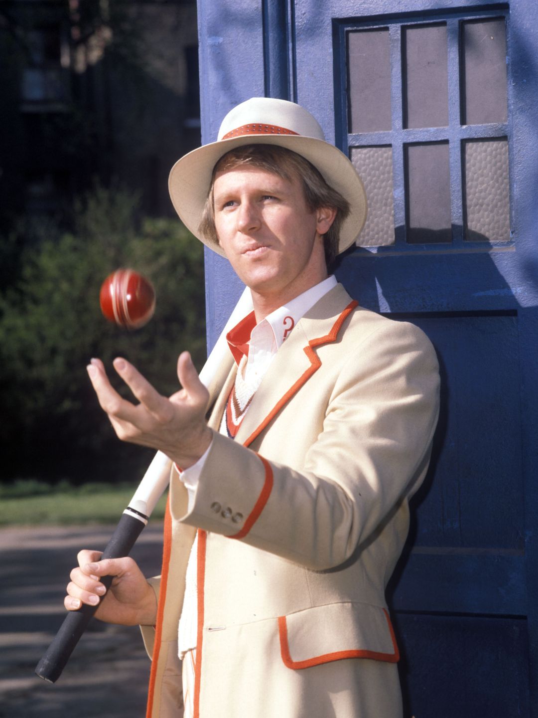 Peter Davison in character as The Doctor with a cricket ball