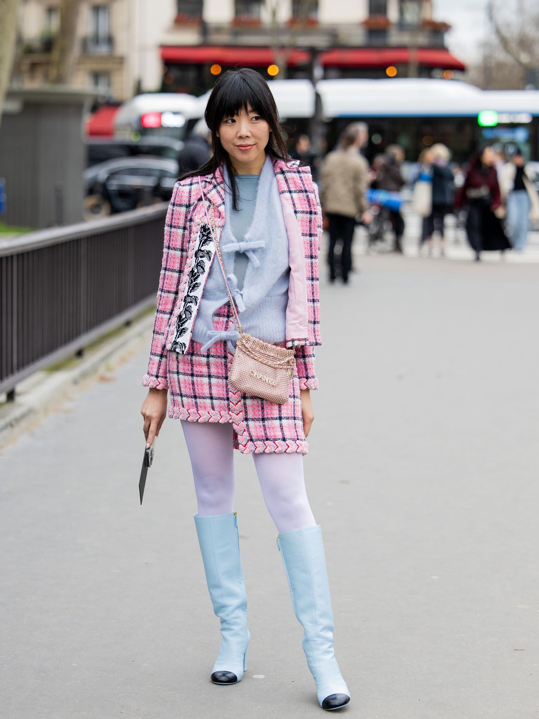 Susie Lau wears pink checkered jacket and matching skirt in Paris. ,