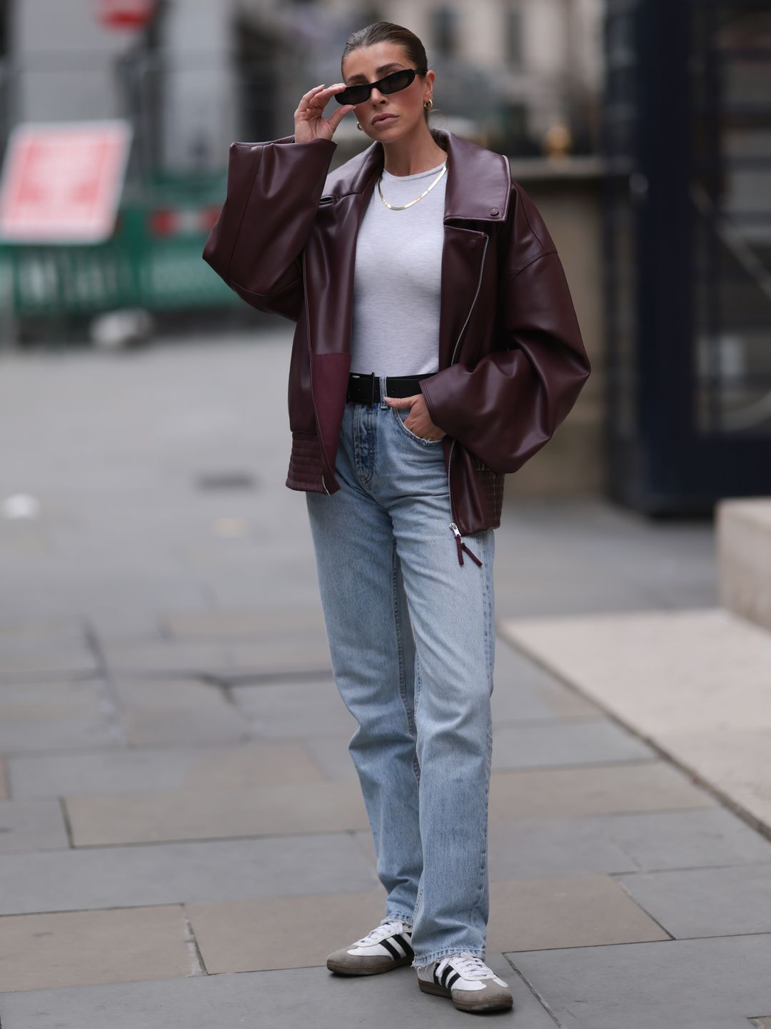 woman in jeans and adidas shoes