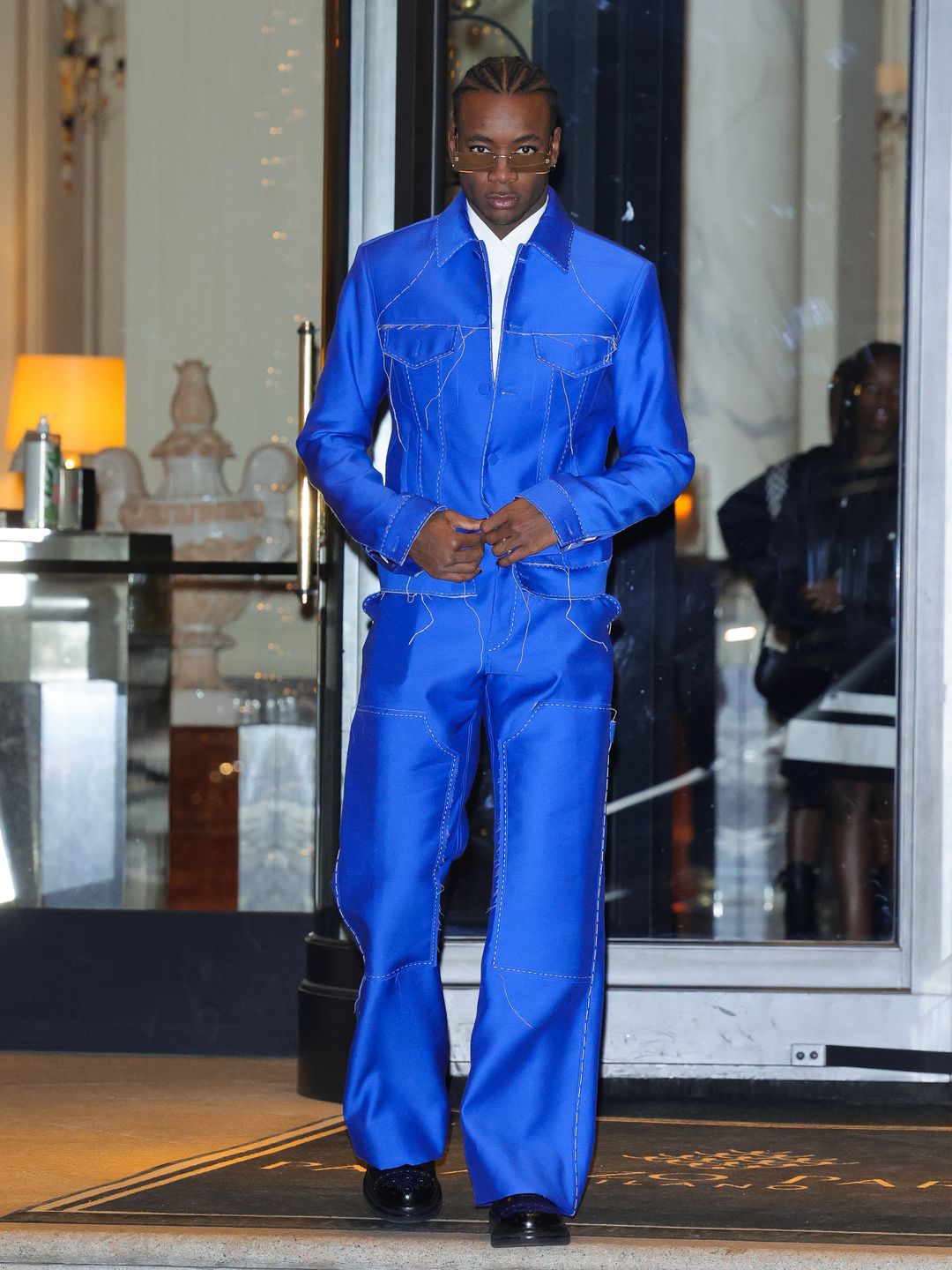David Banda wearing blue jacket and trousers 