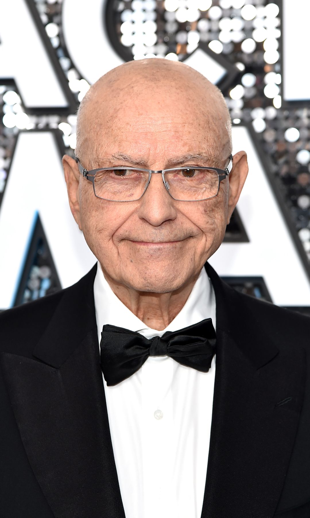 Alan Arkin in a black tuxedo