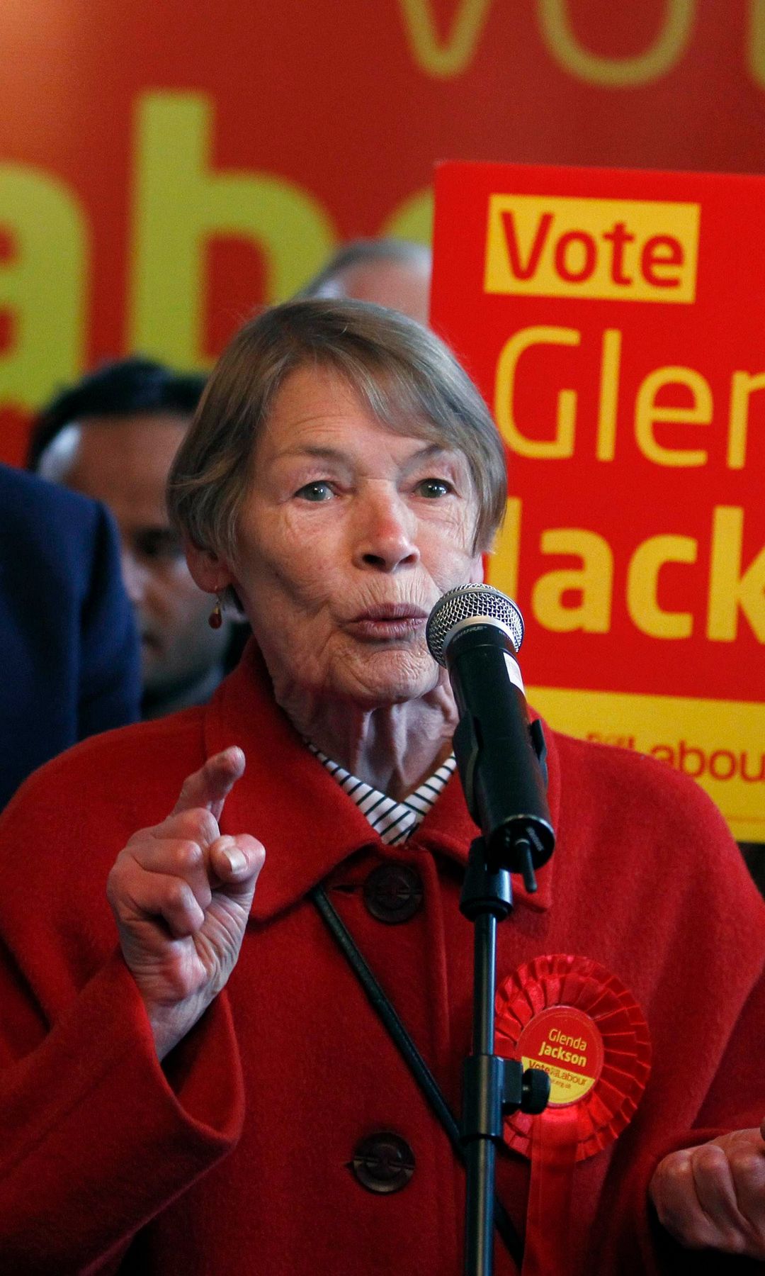 Glenda Jackson delivering a speech with Gordon Brown in the background