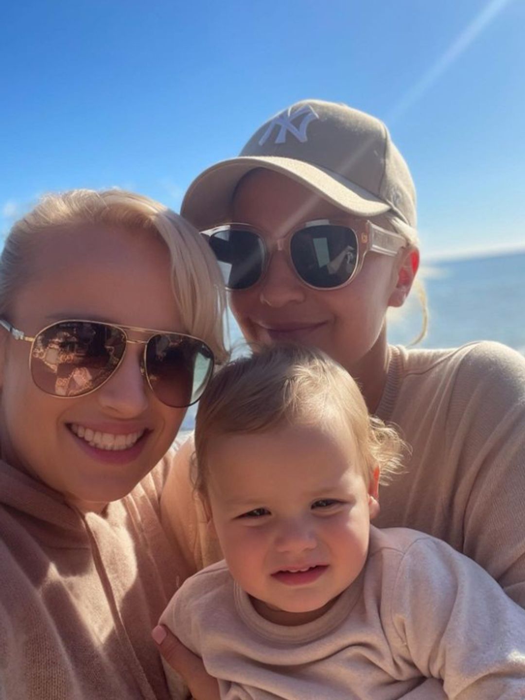 Rebel Wilson and her fiancee with their daughter