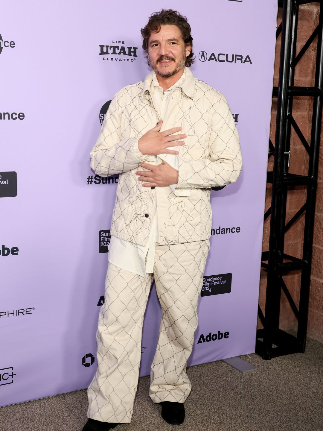 Pedro Pascal attends the "Freaky Tales" Premiere during the 2024 Sundance Film Festival wearing a cream two piece suit and black shoes