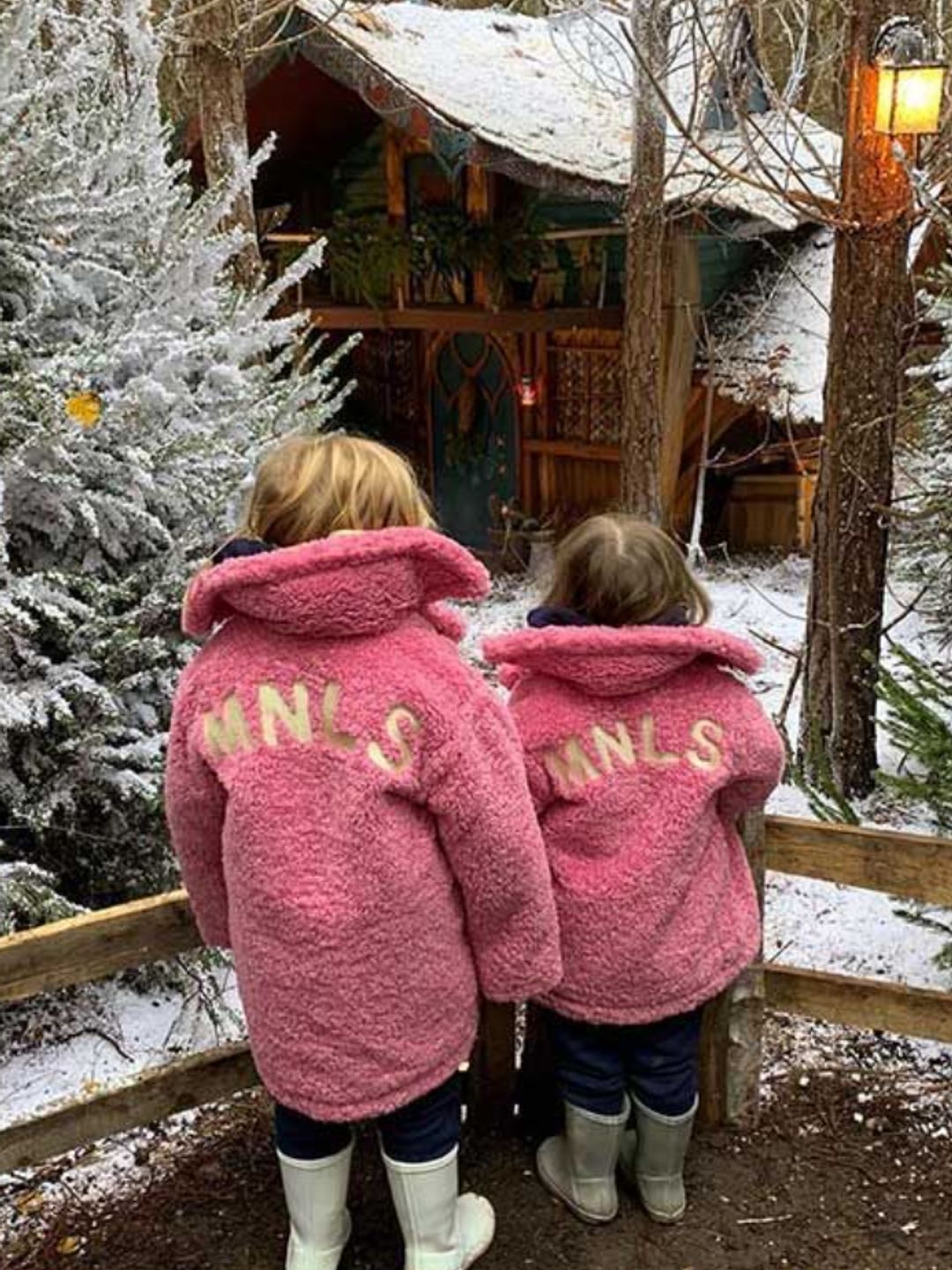 Two young girls in pink jackets