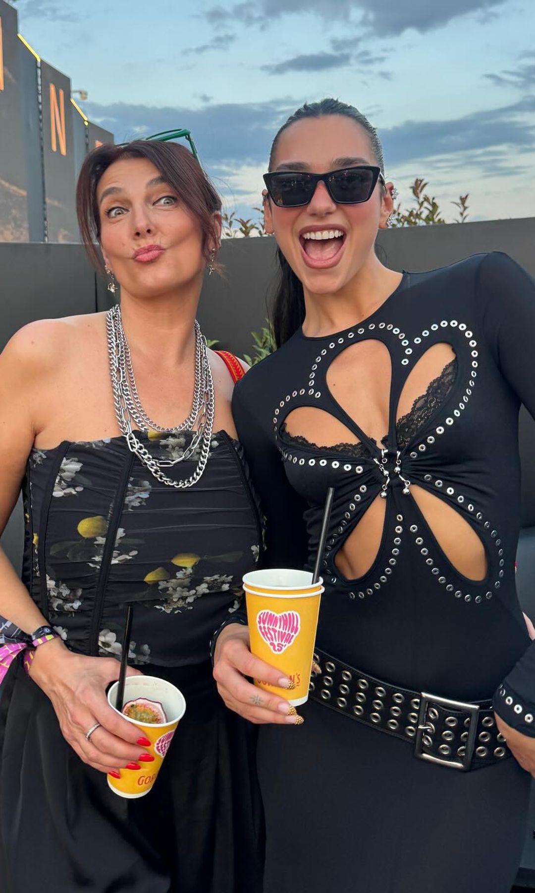 Dua Lipa poses in a cutout dress at Sunny Hill Festival with her mother