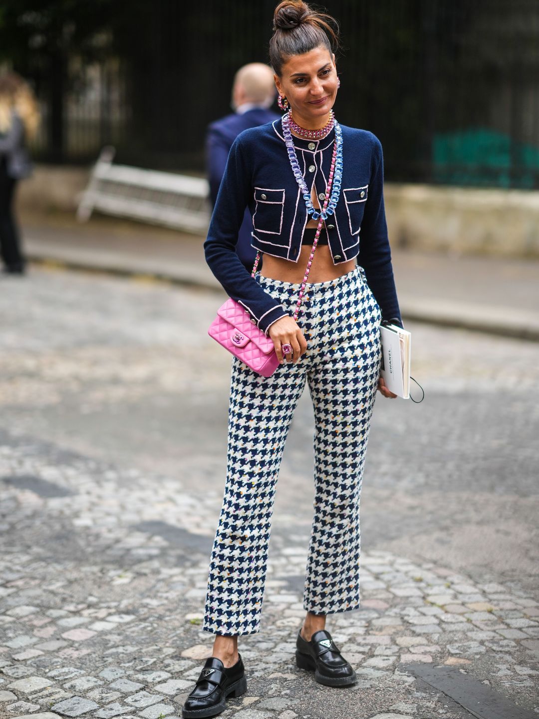 Giovanna Battaglia wears cropped navy cardigan and houndstooth trousers 