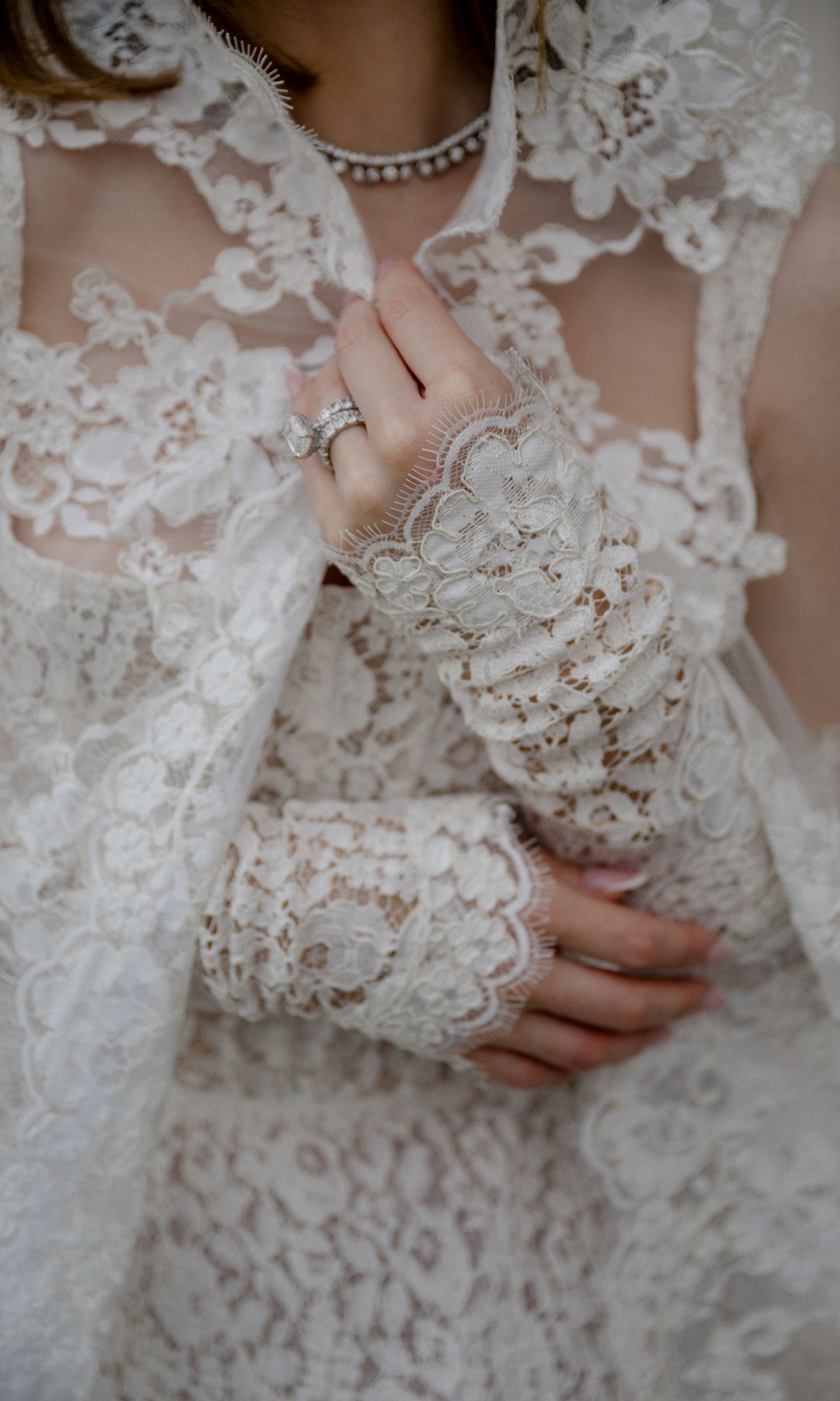 Cat Harding's lace gloves matches her gown