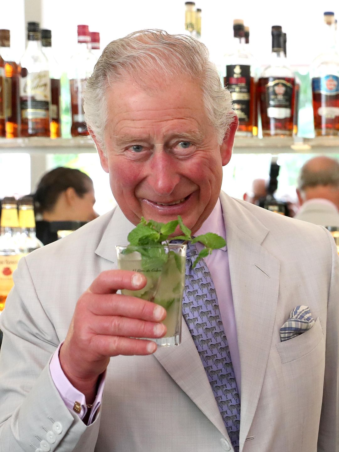 King Charles drinking a mojito garnished with mint during Cuba visit 