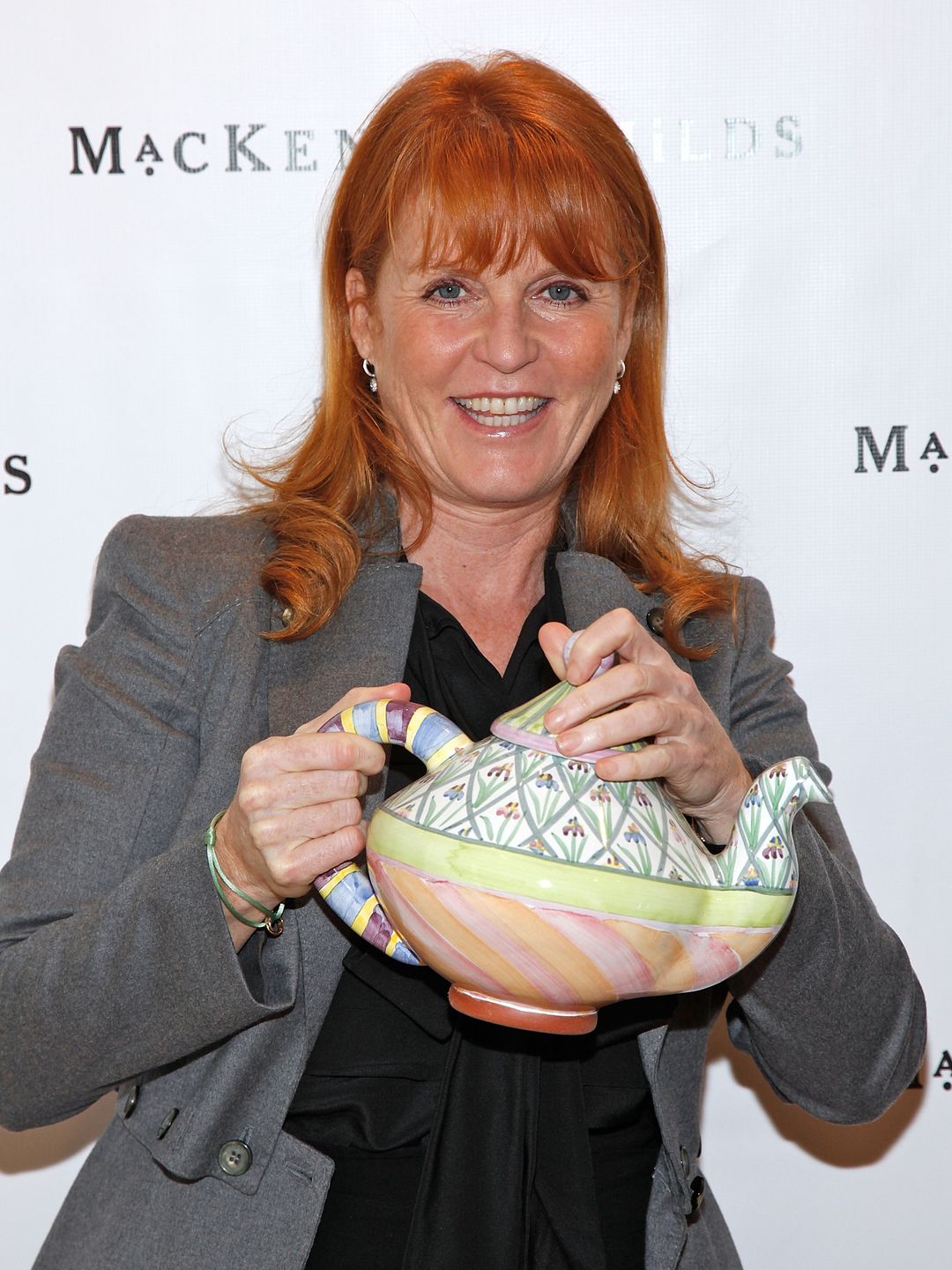Sarah Ferguson holding a multi-coloured teapot