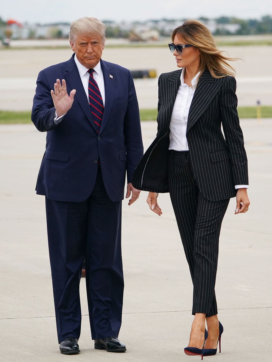 US President Donald Trump and First Lady Melania Trump step off Air Force One upon arrival at Cleveland Hopkins International Airport in Cleveland, Ohio on September 29, 2020. - President Trump is in Cleveland, Ohio for the first of three presidential debates. 