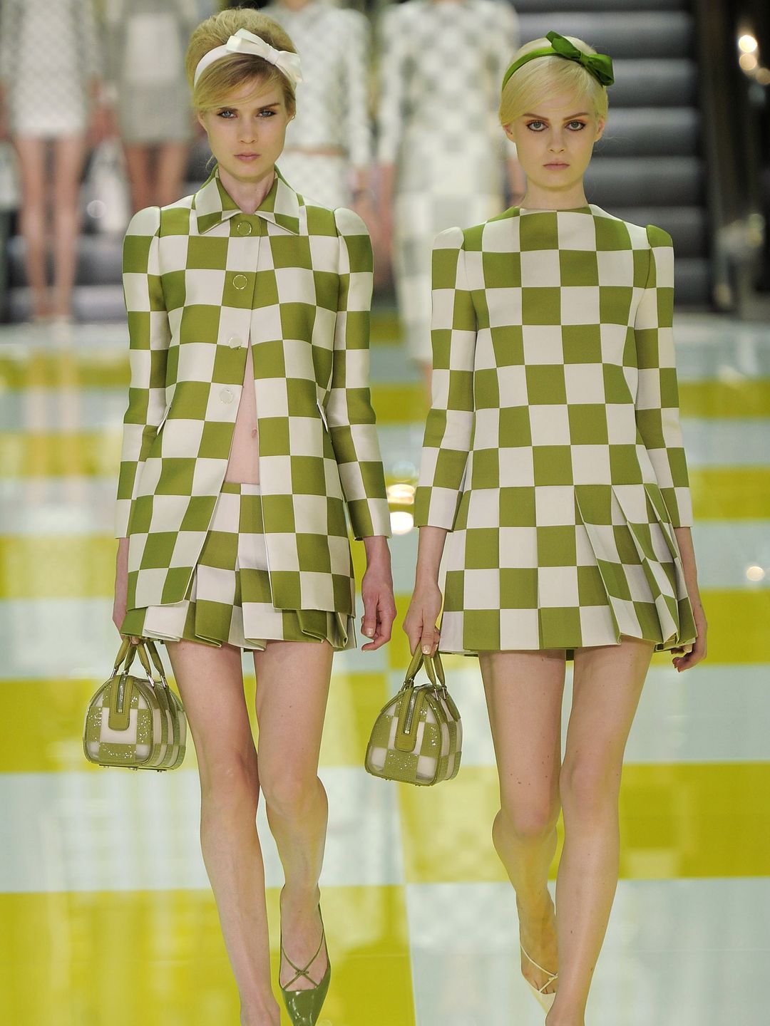 A model walks the runway at the Louis Vuitton Spring Summer 2013 fashion show in green and white dressed