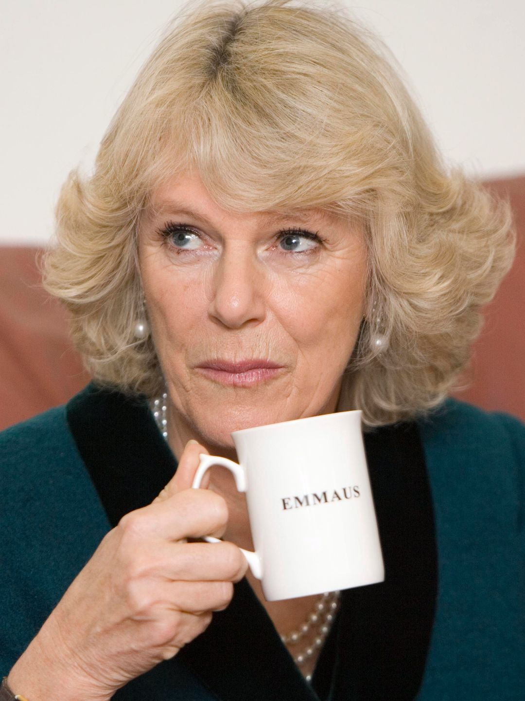 Queen Camilla holding a mug of tea