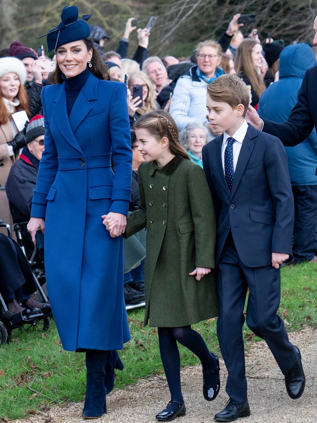 Catherine, Princess of Wales (L) with Prince George of Wales (R) and Princess Charlotte of Wales (C) attend the Christmas Day service at St Mary Magdalene Church on December 25, 2023 in Sandringham, Norfolk.