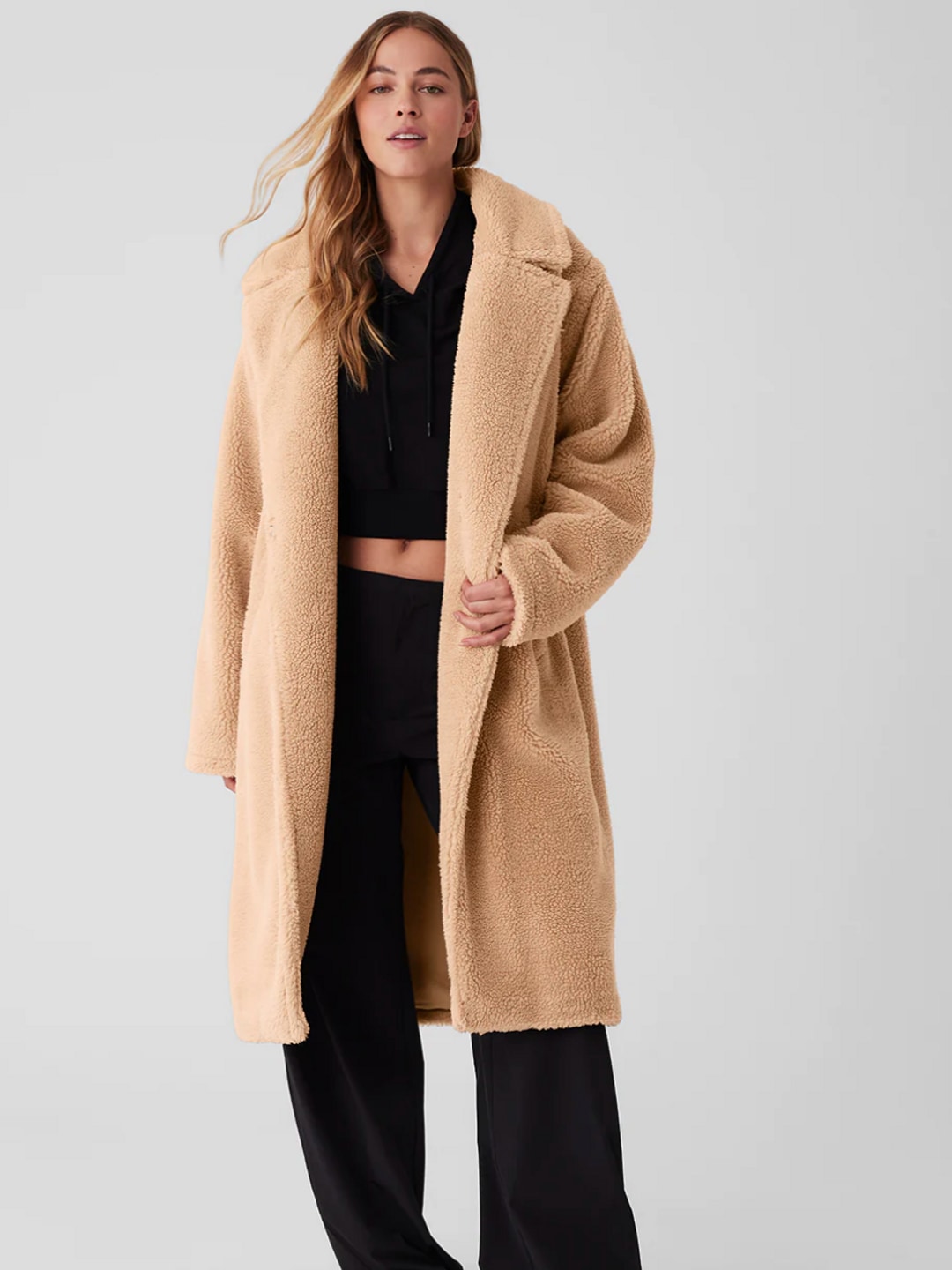 Model wearing camel teddy coat 