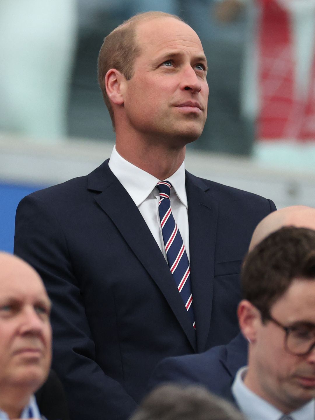 Prince William in a suit at football match
