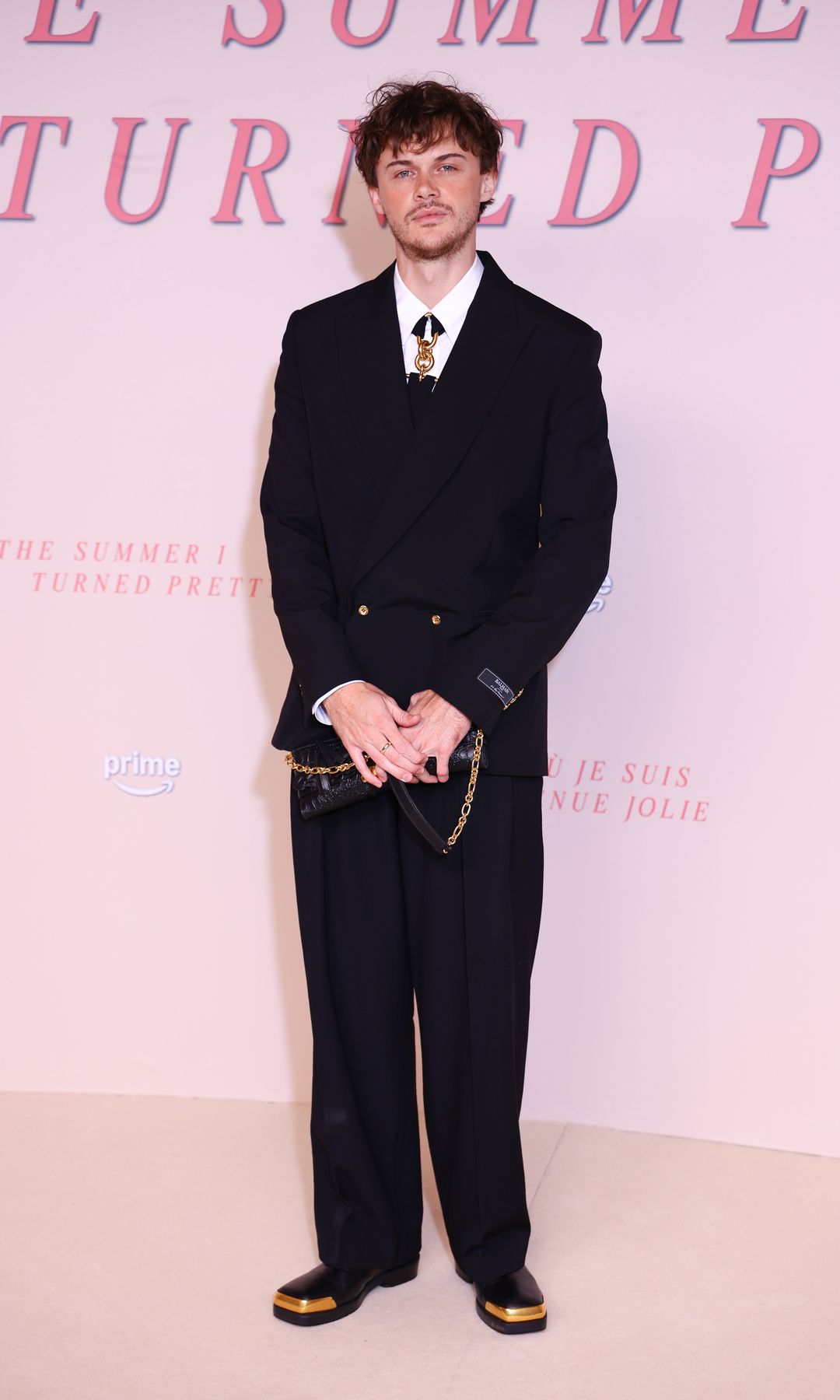 Christopher Briney looks sharp in his designer suit at the "The Summer I Turned Pretty" - Season Three, Prime Video Photocall