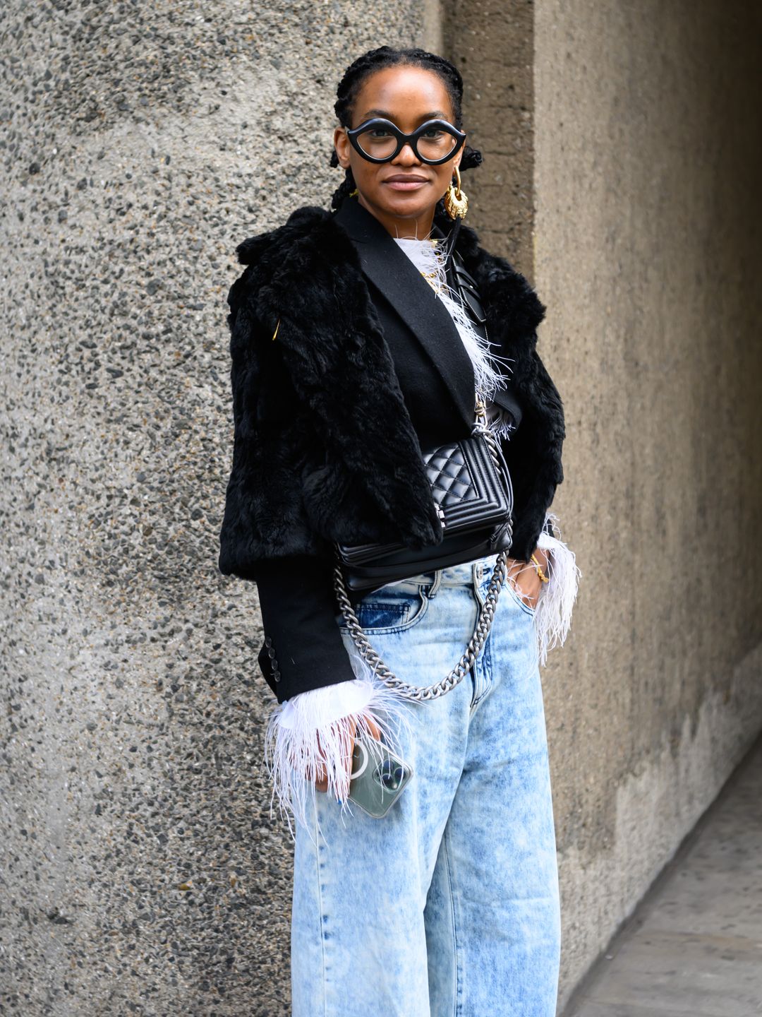 Stylist Barabara Ayozie Fu Safira wearing a vintage jacket outside the Edward Crutchley show during London Fashion Week in February 2024.