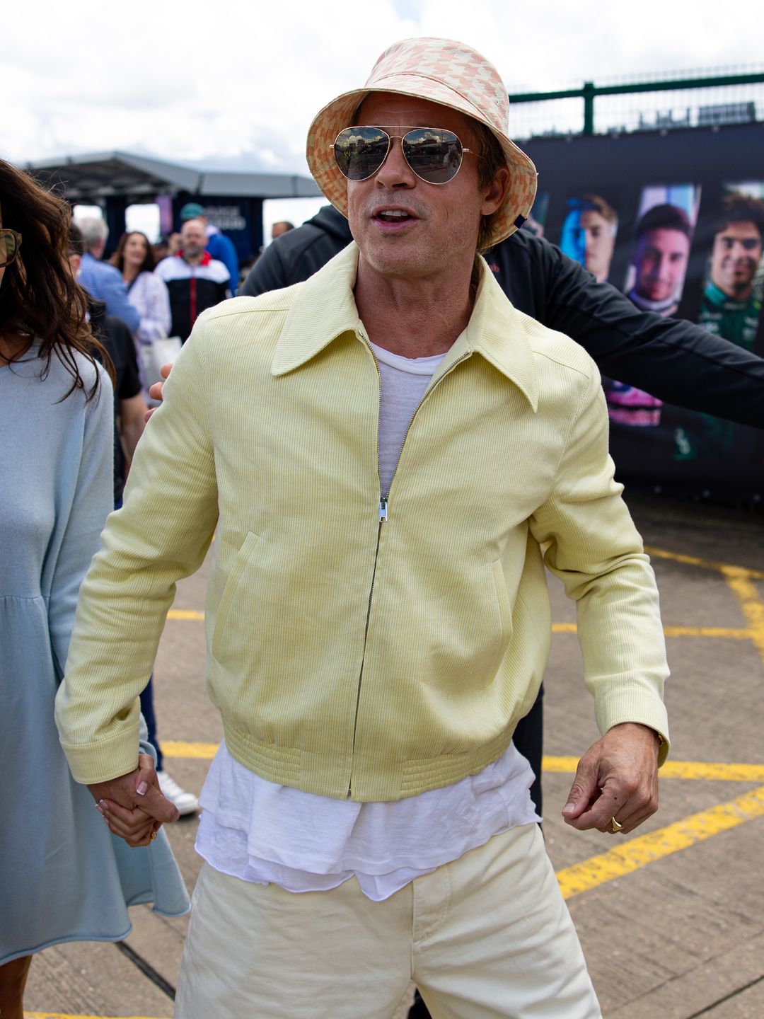 NORTHAMPTON, ENGLAND - JULY 7: Actor Brad Pitt and girlfriend Ines De Ramon walk in the paddock during the F1 Grand Prix of Great Britain at Silverstone Circuit on July 7, 2024 in Northampton, United Kingdom. (Photo by Kym Illman/Getty Images)