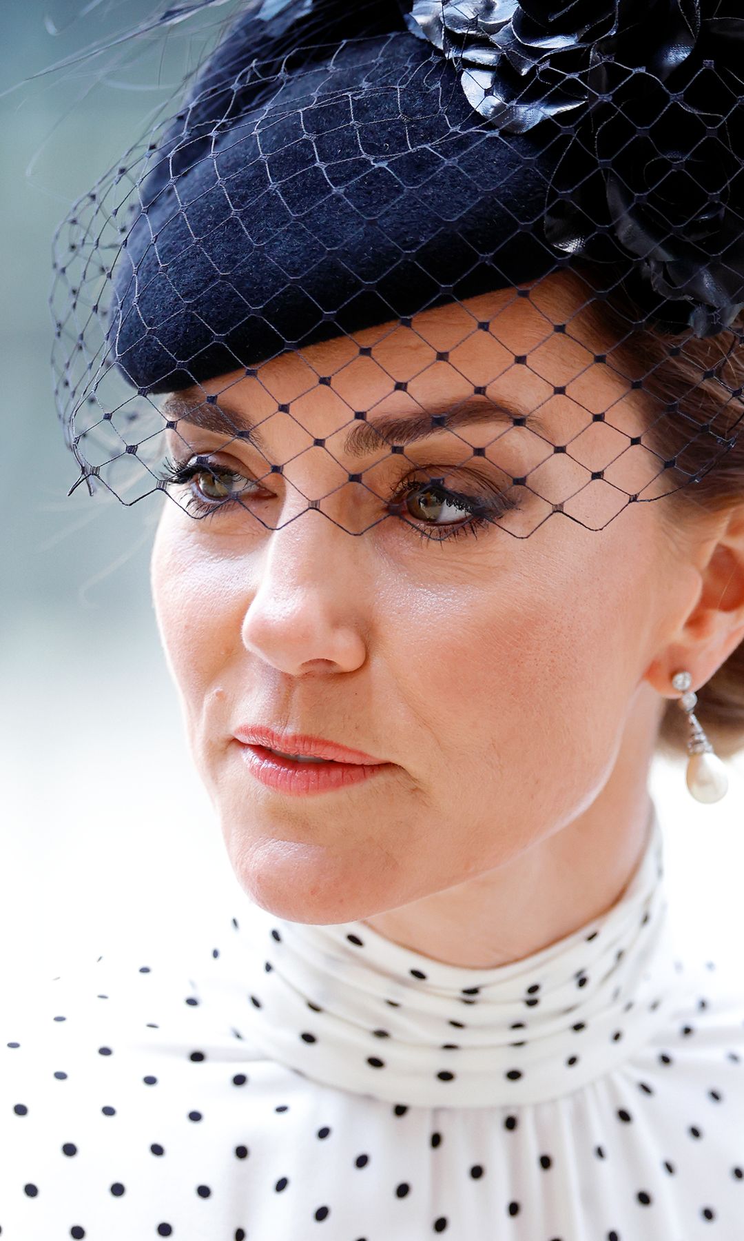 Princess Kate wearing polkadot dress and navy pillbox fascinator for a Service of Thanksgiving on the 80th anniversary of VE Day