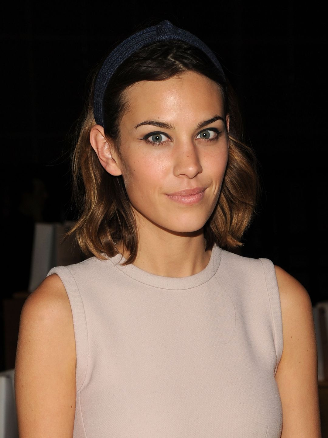 Alexa Chung attends the Marc Jacobs SS11 Show at NYState Armony, 68 Lex on September 13, 2010 in a nude dress and headband