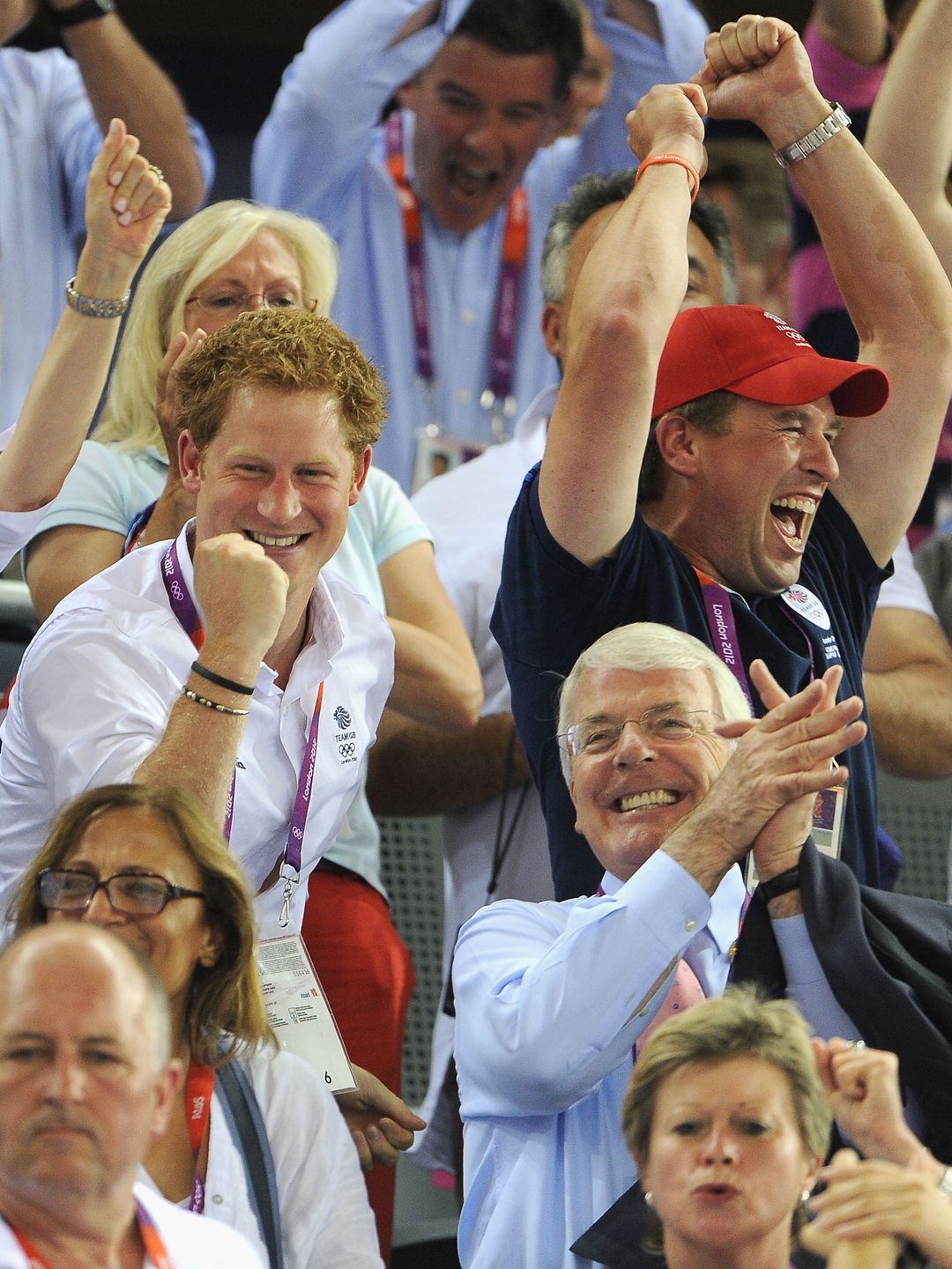 Peter Phillips and Prince Harry cheer during track cycling at London 2012 Olympics