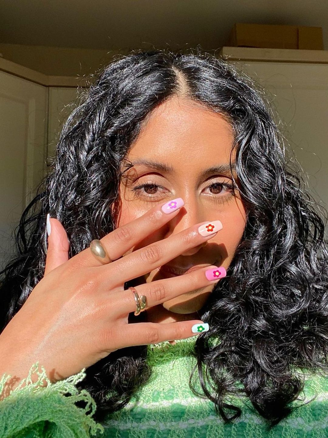Aamirah Essof showing off bright nails 