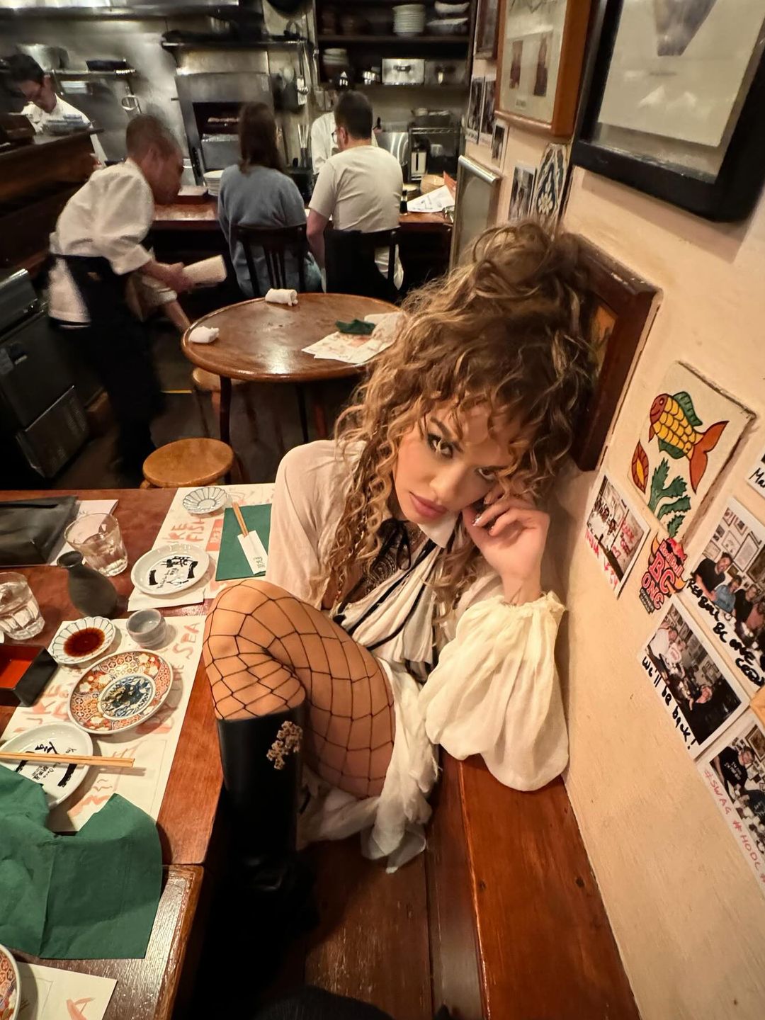 Rita Ora shares an image of herself having dinner